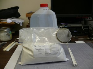 Distilled water, wheat paste mix, and mesh strainer.